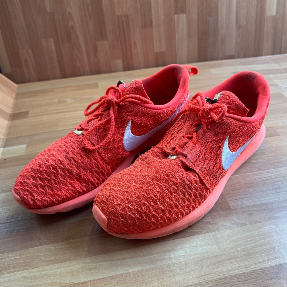 Nike roshe flyknit bright orange sneakers size 10.5